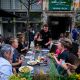 View of people eating and drinking at the outside seating at The Local Minneapolis in downtown Minneapolis