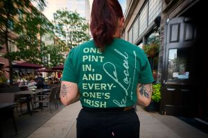 Back view of green swag t-shirt for The Local Minneapolis